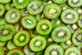 Top view of heap of sliced kiwi as textured background