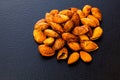 Top view heap of unpeeled fried almonds Royalty Free Stock Photo