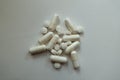 Top view of heap of white magnesium citrate capsules and vitamin K tablets Royalty Free Stock Photo