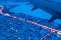 Top view from a height of flight on the night city from the window of the plane Royalty Free Stock Photo