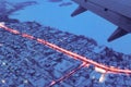 Top view from a height of flight on the night city from the window of the plane Royalty Free Stock Photo