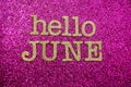 Hello June alphabet letter on pink glitter background