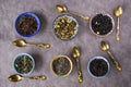 Top view of the herbal and natural dry tea variation in bowls with  vintage spoons Royalty Free Stock Photo