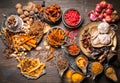 Top view Herbs for cooking, such as red curry, stewed or tom yum soup, such as shallots, garlic, dried chilies, chili peppers,