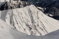 Top view of high grey mountain peaks covered with pure snow