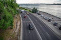 Top view of the highway with cars along the Sicheslavskaya embankment in Dnipro. Cityscape with