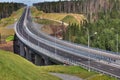 Top view of highway crossing forest, and bridge over river. Royalty Free Stock Photo