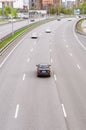 Top view of highway road, car traffic in traffic lanes, transport concept. Vehicles are entering the city on freeway Royalty Free Stock Photo