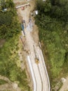 Top view of a highway under construction, cutting through a rural area. Idle worksite due to the weekends. In Dasmarinas, Cavite