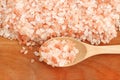 Top view of himalayan pink salt in wooden spoon on the table with copy space Royalty Free Stock Photo