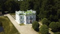 Top view of historic building with garden and pond. Creative. Beautiful park and garden with Baroque estate. Tourists Royalty Free Stock Photo