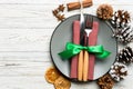 Top view of holiday dinner decorated with dried fruit and cinnamon on wooden background. Set of plate, urensil and New Year Royalty Free Stock Photo