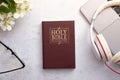 Top View of Holy Bible on working table with headphones Royalty Free Stock Photo