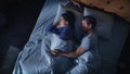 Top View Home: Happy Young Couple Cuddling Together in the Bed Sleeping at Night. Beautiful Royalty Free Stock Photo