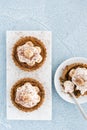 Top View of Homemade Banoffee Pie Tartlets on Blue Concrete