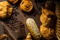 Top view -homemade bread consists of slice and bun, French bread, muffins and croissants with coffee beans in hemp bag, placed on Royalty Free Stock Photo