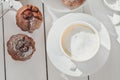 top view of homemade chocolate muffins with berry filling and a cup of coffee on wooden table. home baking, tasty Royalty Free Stock Photo