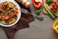 Top view of homemade omelet for breakfast on wooden table with ingredients. Royalty Free Stock Photo