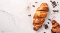 Top view of a homemade puff croissants and chocolate pieces on a white marble tabletop. Tasty Pain au Chocolat with Royalty Free Stock Photo