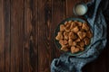 Top view on homemade wholegrain cookies with oatmeal, raisin, nuts, seeds and milk on brown rustic wooden background. Healthy