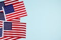 Top view on horisontal composition with american flags on light blue background with copyspace. National symbol of USA - flag Old Royalty Free Stock Photo