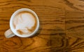 Top view of hot cappuccino coffee cup on wooden table in coffee cafe. copy space for adding text Royalty Free Stock Photo