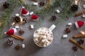 Hot chocolate cup and marshmallows against grey background with Christmas theme Royalty Free Stock Photo