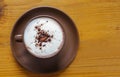 Top view of hot cocoa with frothed milk in ceramic cup
