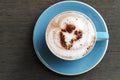 Top view of hot cocoa latte with heart shaped frothed milk in ce