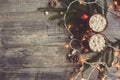 Top view of hot cocoa with marshmallows on rustic wooden table with christmas lights