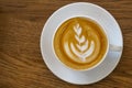 Top view of hot coffee latte cappuccino cup on wood table texture background. Royalty Free Stock Photo