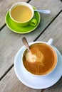 Top view of hot coffee latte and a cup of green tea Royalty Free Stock Photo