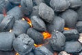 Top View Of Hot Flaming Charcoal Briquettes Glowing In The BBQ Grill Pit. Abstract Red Black Background, Texture Or Wallpaper. Royalty Free Stock Photo