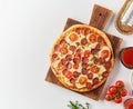 Top view hot homemade Italian pepperoni pizza with salami, mozzarella on white table Royalty Free Stock Photo