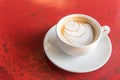 Top view hot latte coffee in white cup on wooden table Royalty Free Stock Photo