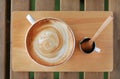 Top view hot latte coffee on wooden table Royalty Free Stock Photo