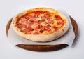 Top view of hot pizza on a wooden stand. Royalty Free Stock Photo