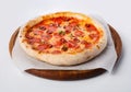 Top view of hot pizza on a wooden stand Royalty Free Stock Photo