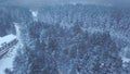 Top view of the hotel in the forest in winter. Clip. Snow-covered path along the hotel in the evening Royalty Free Stock Photo