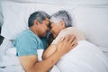 Top view, hug and senior couple in bed, relax and sleeping with happiness, quality time and loving together. Romance