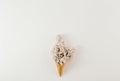 Top view ice cream cone branch flowers white background Minimal spring Flat lay