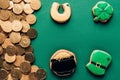 top view of icing cookies and golden coins, st patricks day concept Royalty Free Stock Photo