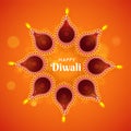 Top view of illuminated oil lamps (Diya) decorated on orange rangoli bokeh background for Happy Diwali celebration. Can be used as