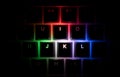 Top view of illuminated RGB keycaps keys in the dark Royalty Free Stock Photo