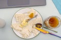 Top view image of acimo bread with butter, orange marmalade and knives Royalty Free Stock Photo