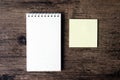 Top view image of blank notebook and empty sticky note paper on Royalty Free Stock Photo