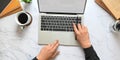 Top view image of businessman`s hands using a computer tablet with white blank screen that putting on marble texture table. Royalty Free Stock Photo