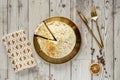 Top view image of carrot cake on plate and golden cutlery with coffee beans, dried orange, tea towel Royalty Free Stock Photo