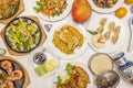 Top view image of Chinese food dishes. Lemon Chicken, Pekin Duck, Chinese Rice Pasta, Stuffed Gyozas, Mango and Grilled Shrimp Royalty Free Stock Photo