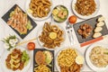 Top view image of Chinese-Spanish fusion dishes with wok stir-fry noodles, tres delicias rice, Andalusian fish fry, grilled Royalty Free Stock Photo